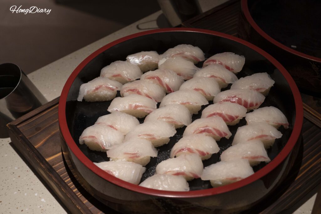 Display of white fish sushi at the sushi station in PUKU PUKU buffet